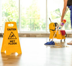 Safety,sign,with,phrase,caution,wet,floor,and,cleaner,indoors.